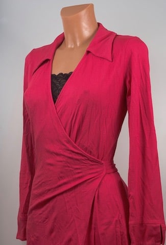 rayon, fashion and deforestation, clothing, viscose. Pink red viscose wrap dress with long sleeves and v-neck. viscose is a type of rayon.